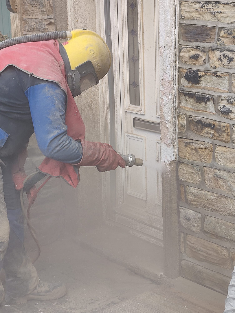 Stripping old paint using a blasting technique